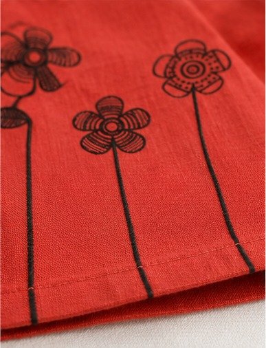 Girls' Rust Floral and Bird Pinafore Dress – Close-up: print & pocket
