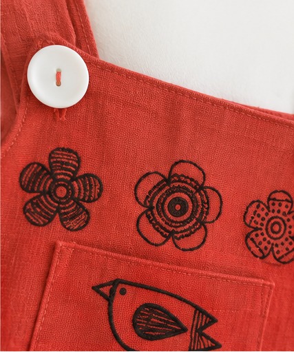 Girls' Rust Floral and Bird Pinafore Dress – Close-up: neckline, straps & buttons